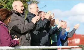  ?? Leo Michaelovi­tz ?? ●●Ramsbottom United supporters enjoy the taste of victory, not to mention some dry weather!