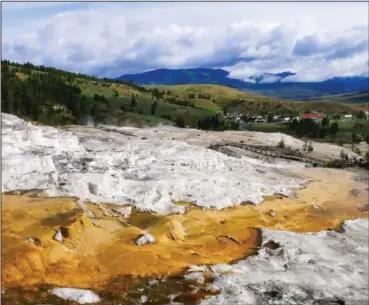  ??  ?? Mammoth Hot Springs in Yellowston­e National Park in Wyoming is seen in June 2017. (File photo/AP/Santa Fe New Mexican)