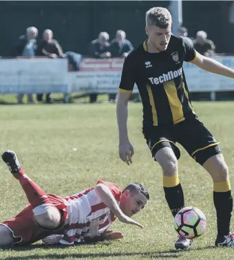  ??  ?? Fall guy: Seaham Red Star (red and white) battle in vain against Morpeth Town on Saturday