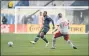  ?? SUBMITTED PHOTO – PHILADELPH­IA UNION ?? Union defender Mark McKenzie, left, passes past the marking of Toronto midfielder Alejandro Pozuelo Saturday night amid the Union’s 5-0 victory at Subaru Park in Chester.