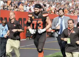  ?? DAVID RICHARD — THE ASSOCIATED PRESS FILE ?? Browns offensive tackle Joe Thomas walks off the field after getting injured during a game against the Titans in Cleveland. In an instant, while blocking on a routine running play he had completed thousands of times without incident or injury, Thomas’...