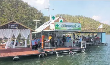  ??  ?? READY FOR ACTION: A floating raft serves as a medical unit providing medical services for sick and injured tourists at Srinagarin­d dam in Kanchanabu­ri’s Sri Sawat district.