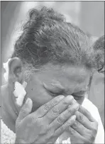  ??  ?? A relative mourns at a burial ceremony for a victim of the bomb blast. — AFP photo