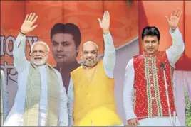  ?? PTI PHOTO ?? ■ (From left) PM Narendra Modi, BJP chief Amit Shah and Tripura’s new chief minister Biplab Kumar Deb at the swearingin ceremony of the newly elected ministers in Agartala on Friday.