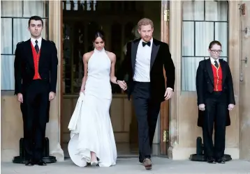  ??  ?? The newly married Duke and Duchess of Sussex, Meghan Markle and Prince Harry, leave Windsor Castle after their wedding. — IC