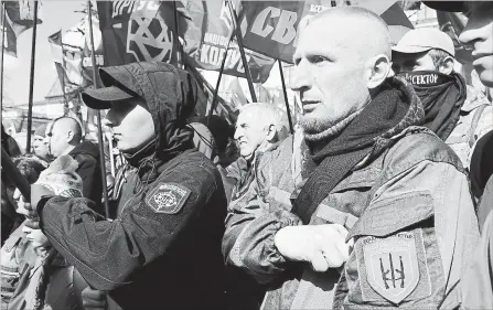  ?? EFREM LUKATSKY
THE ASSOCIATED PRESS ?? Ultra-right activists at a rally in Kyiv, Ukraine. Racist and anti-Semitic views are expressed by mainstream political leaders in parts of Europe.