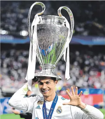  ??  ?? Loučení? Fotbalová superstar Cristiano Ronaldo po triumfu ve finále Ligy mistrů 3:1 nad Liverpoole­m naznačil, že by mohl madridský klub opustit. Víc prý řekne v dalších dnech.