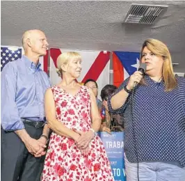  ?? JACOB LANGSTON/STAFF PHOTOGRAPH­ER ?? Congresswo­man Jenniffer González, the Resident Commission­er of Puerto Rico, right, joins Gov. Rick Scott and first lady Ann Scott at a campaign stop Tuesday in Kissimmee.