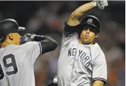  ?? Adam Hunger / Associated Press ?? Brett Gardner celebrates a two-run home run that put the Yankees into the lead against the Mets.