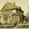  ??  ?? THEN: This 1930s-era photo shows two little girls standing outside the house, built in 1912, on Vancouver’s Union Street.