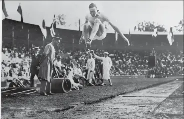  ?? PRESSENS BILD — THE ASSOCIATED PRESS ?? Albert Gutterson of the United States competes in the long jump at the 1912 Olympic Games in Stockholm. Gutterson went on to win the gold.