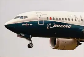  ?? Elaine Thompson / Associated Press ?? Federal regulators have approved a Boeing procedure to fix about 100 jets that have been sitting because of an electrical-grounding issue for a month. The electrical problem was the latest issue affecting Boeing’s best-selling 737 Max jet, which was grounded for nearly two years after two deadly crashes.