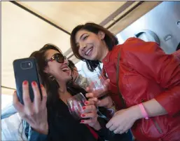  ?? BEA AHBECK/NEWS-SENTINEL FILE PHOTOGRAPH ?? Esmeralda Martinez of Lodi and Andrea Fatone of Turlock take a selfie at Jessie’s Grove Winery during the Wine and Chocolate weekend in Lodi on Feb. 9, 2019.