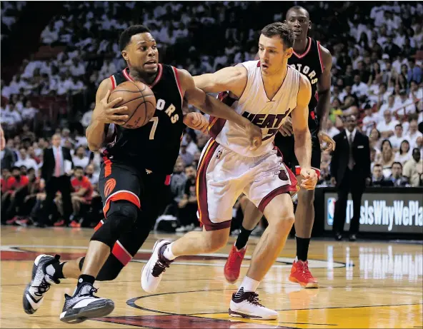  ?? — GETTY IMAGES ?? Toronto’s Kyle Lowry drives against the Heat’s Goran Dragic during the third quarter of their NBA second-round playoff game at American Airlines Arena in Miami on Saturday night. The Raptors won 95-91 to take a 2-1 series lead.