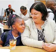  ??  ?? Oklahoma City Public Schools Superinten­dent Aurora Lora talks to Raelysha Fay, 5, at the beginning of the first day of school Tuesday at Thelma Parks Elementary School in Oklahoma City.
