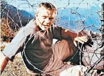  ?? ?? Steve McQueen as Captain Virgil Hilts in the 1963 film The Great Escape. The real story was even more dramatic
Front cover: BFC traitors Alfred Minchin and Kenneth Berry with SS officers in 1944
