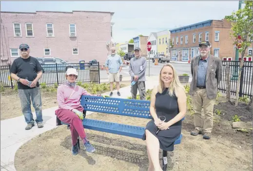  ?? Paul Buckowski / Times Union ?? Osgood/south Troy Neighborho­od Associatio­n members Alan Mcclintock, left, Diane Bell, Chuck Conroy, Armando Soto, Emily Cooper-kelley and Stanley Hadsell relax in a park that was once a parking lot — Lots of Hope — at Second and Jackson streets.