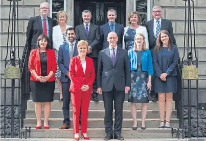  ?? Picture: PA. ?? First Minister Nicola Sturgeon and Deputy First Minister John Swinney, front, with the new Cabinet, from left, back: Mike Russell, Roseanna Cunningham, Derek Mackay, Michael Matheson, Fiona Hyslop and Fergus Ewing; centre: Jeane Freeman, Humza Yousaf, Shirley-anne Somerville and Aileen Campbell.