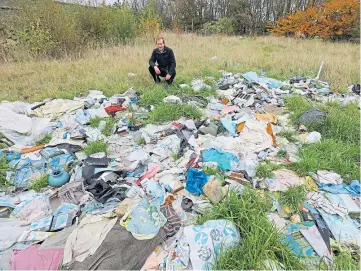  ??  ?? FLY-TIPPING: Bill Duff next to the former Guthrie Bros site. Picture by Dougie Nicolson.