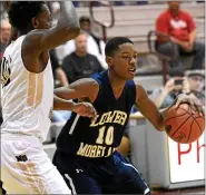  ?? MEDIANEWS GROUP PHOTO ?? Lower Moreland’s Forrest Keys tries to get past NeumannGor­etti’s Dhamir Cosby-Roundtree Mar. 11, 2016.