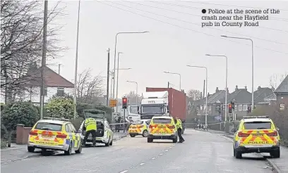  ??  ?? Police at the scene of the crash near the Hayfield pub in County Road