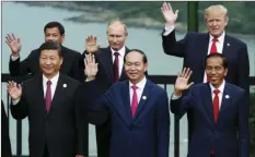  ??  ?? Leaders pose during the family photo session at the APEC Summit in Danang, Vietnam on Saturday. FRONT, FROM LEFT China’s President Xi Jinping, Vietnam’s President Tran Dai Quang, Indonesia’s President Joko Widodo, (back left to right); Philippine­s’...