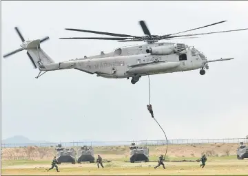  ??  ?? US Marines Corps soldiers and soldiers of Japanese Ground Self-Defence Force (JGSDF)’s Amphibious Rapid Deployment Brigade take part in a joint drill at JGSDF’s Camp Ainoura in Sasebo. — Reuters photo