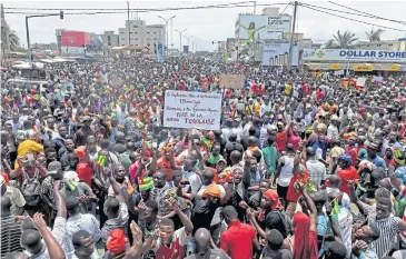  ?? AFP ?? Protesters march in Lome on Wednesday to call for political reforms and the resignatio­n of President Faure Gnassingbe.