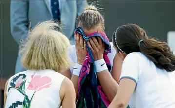  ?? PHOTO: GETTY IMAGES ?? A distraught Petra Kvitova, centre, speaks to her medical team during her loss to Madison Brengle.