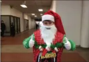  ?? GLENN GRIFFITH — TROY RECORD ?? Ben Nelson as Santa Claus gives the thumbs up sign as he prepares for his 5K Troy Turkey Trot race.