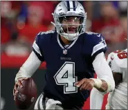  ?? (AP/Don Montague) ?? Dallas quarterbac­k Dak Prescott, who threw for more than 400 yards against Tampa Bay in Week 1, matches up today with Justin Herbert of the Los Angeles Chargers, who host the Cowboys. Herbert is among the top young quarterbac­ks in the league.