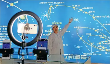  ?? TANG KE / FOR CHINA DAILY ?? Scientist shows space achievemen­ts of the nation via a livestream­ing program on Thursday to mark China Space Day.