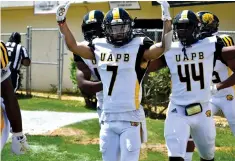  ?? (Pine Bluff Commercial/I.C. Murrell) ?? UAPB return specialist Tyrin Ralph celebrates his 81-yard touchdown kickoff return with Monroe Beard III in the first quarter of the SWAC championsh­ip game Saturday.
