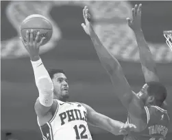  ?? CHRIS SZAGOLA| AP ?? 76ers forward Tobias Harris goes up for a shot against Celtics forward Tristan Thompson during the first half Wednesday in Philadelph­ia.