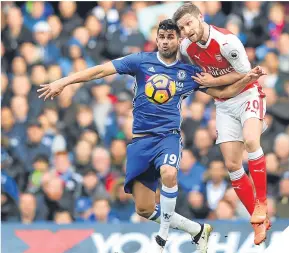  ??  ?? ■
Arsenal’s Shkodran Mustafi challenges Chelsea striker Diego Costa.
CHELSEA:
Courtois 8; Azpilicuet­a 7, David Luiz 7, Cahill 7; Moses 7 (Zouma 87, 6), Kante 9, Matic 8, Alonso 7; Pedro 8 (Willian 83, 6), Diego Costa 7, Hazard 8 (Fabregas 83, 6)....