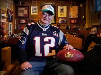  ?? AP Photo/Robert F. Bukaty ?? Don Crisman poses at his home, on Wednesday in Kennebunk, Maine. Crisman is one of three fans who have attended every Super Bowl. This year the trio will have to work coronaviru­s-era precaution­s into the trip.