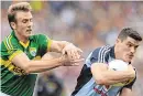  ??  ?? Kerry’s Donnchadh Walsh tries to get to grips with Dublin’s Diarmuid Connolly during their 2013 tussle