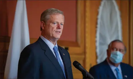  ?? Amanda sabGa / boston herald ?? house speaker ronald mariano, d-Quincy, right, gives his full attention to Gov. charlie baker during the oct. 18 weekly leadership meeting at the state house.