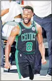  ??  ?? Boston Celtics’ Kemba Walker (8) celebrates after a score against the Miami Heat during the second half of an NBA conference final playoff basketball game on Sept 25, in
Lake Buena Vista, Fla. (AP)