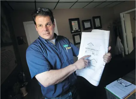  ?? PHOTOS: DAX MELMER ?? Jeff Sylvestre, owner of Lakepoint Homes, holds blueprints for the lottery home his company will build at 25 Mulberry Crescent in Kingsville. “The reward about this house is the good feeling that you get from helping other people,” says Sylvestre.