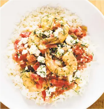  ?? Daniel J. van Ackere / AP ?? Greek-Style Shrimp with Tomatoes and Feta improves on the restaurant version with just a few tweaks in the technique. America’s Test Kitchen offers a foolproof recipe for home cooks.