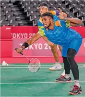  ?? — PTI ?? India’s Rankireddy Satwiksair­aj (foreground) and Chirag Shetty in action during the men’s doubles group stage badminton match in Tokyo on Saturday.