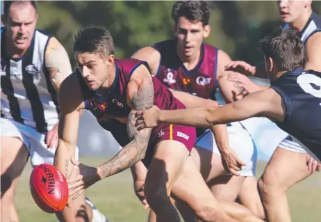  ?? Picture: GLENN HAMPSON ?? Palm Beach Currumbin’s Josh Woolley gets to the ball first in the Lions’ QAFL victory over the Western Magpies at Salk Oval. The Lions won 12.16 (88) to 11.9 (75).