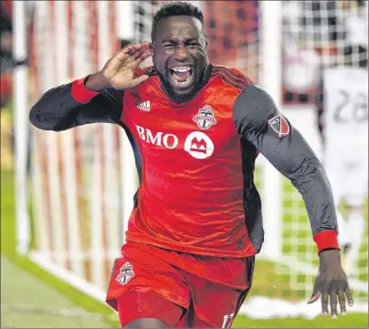  ?? CP PHOTO ?? Toronto FC forward Jozy Altidore (17) celebrates after scoring against the Philadelph­ia Union during second half MLS soccer action in Toronto in this file photo from August. Opposition fans may want to reconsider their booing of Toronto FC’s Altidore...