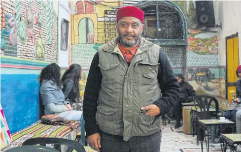  ??  ?? REMEMBERIN­G BETTER TIMES: Ali Boukkaa’s family have been serving coffee in the medina since 1786 when the chechiya market, where his cafe is still based, still attracted a lot of buyers in Tunis.