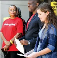  ?? Arkansas Democrat- Gazette/ MITCHELL PE MASILUN ?? State Sen. Joyce Elliott ( from left), D- Little Rock, and writer/ activist Vincent Tolliver listen to Maggie Collins, an eighth- grader at Little Rock’s Horace Mann Middle School, during a news conference Thursday by Grassroots Arkansas.