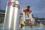  ?? PHELAN M. EBENHACK — ASSOCIATED PRESS ?? The AFC’s Von Miller holds the Pro Bowl trophy after his team beat the NFC, 24-23, on Jan. 29 in Orlando, Fla. Miller was the Defensive Player of the Game.