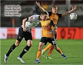  ?? ?? Craig Forsyth heads the ball forward for Derby County.