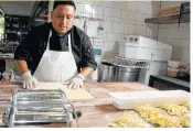  ?? David Rossman ?? Fernando Rios prepares to cut fresh pasta in the dough room at Weights + Measures.