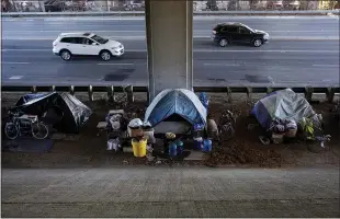  ?? DAI SUGANO STAFF ARCHIVES ?? Residents say they’ve grown frustrated with the inability of state and local leaders to fix long-standing and obvious problems — homeless and RV camps popping up along city streets, like this encampment at a Highway 87 underpass near the corner of Coleman Avenue and Santa Teresa Street in San Jose.